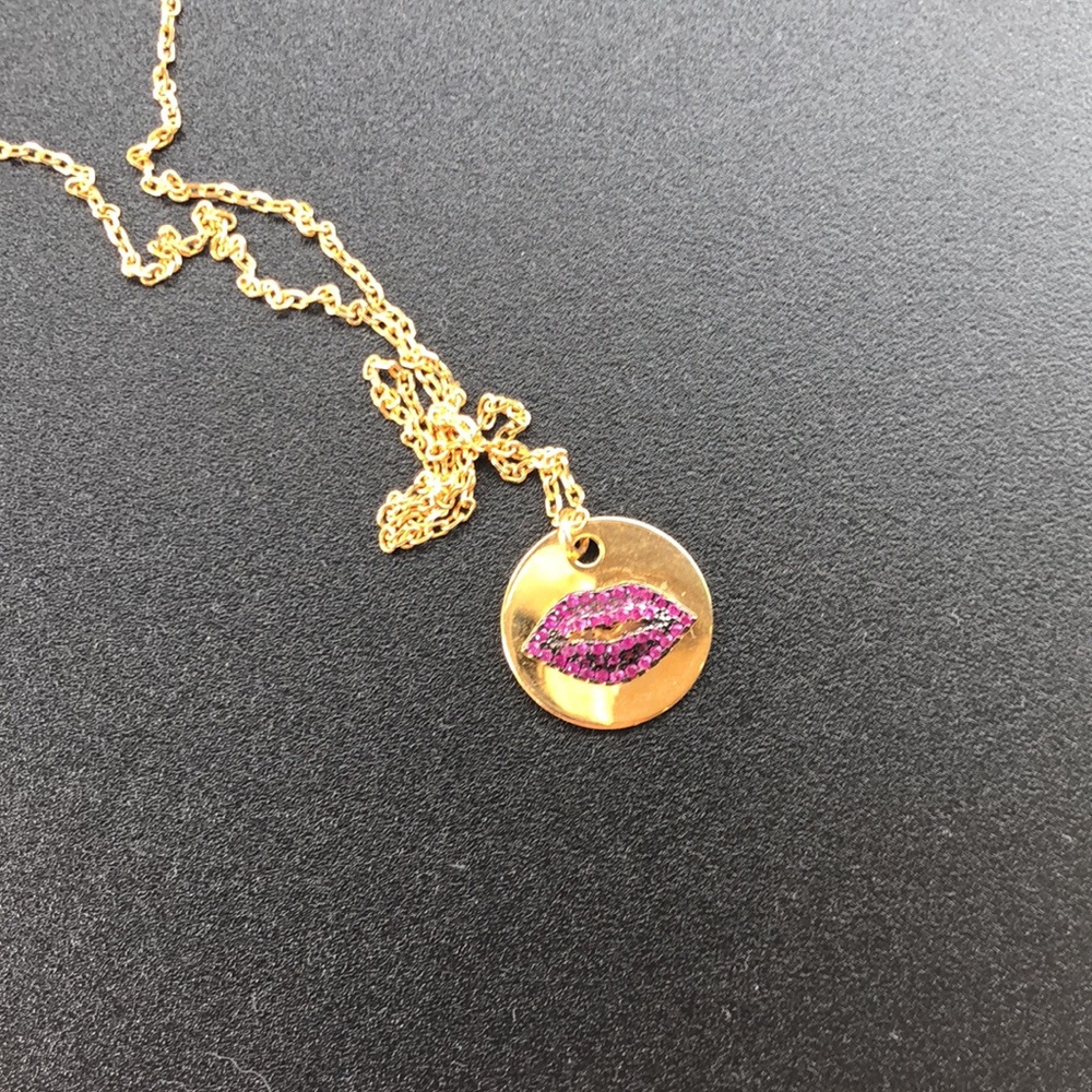 Red jeweled lips on disk necklace